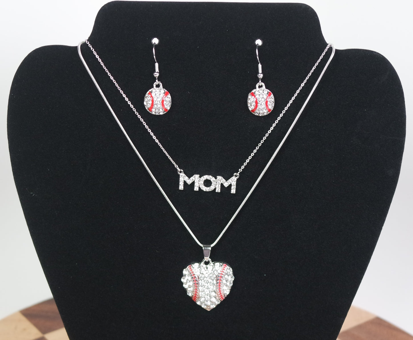 Jewelry set baseball mom - themed earrings on a black bust