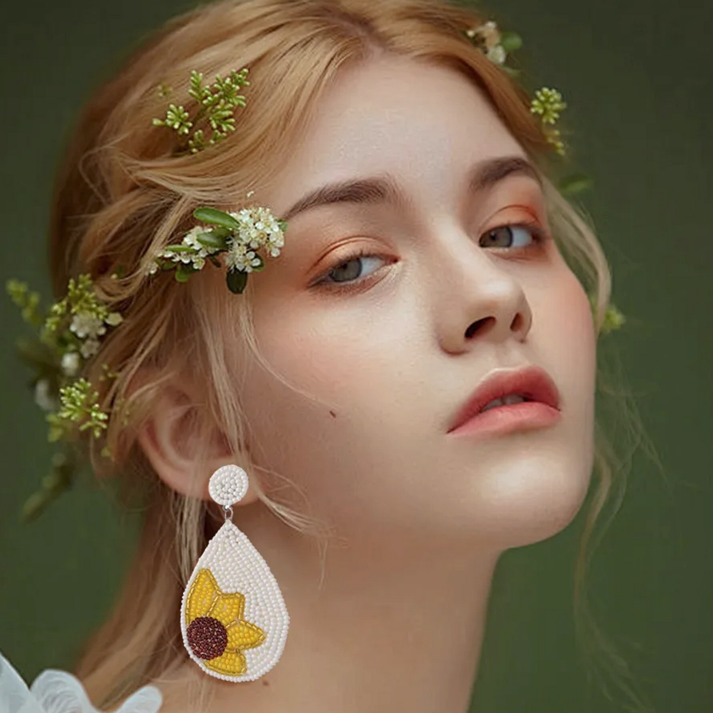 Woman Wearing Beaded Tear drop shape earrings with Sunflower Bead design