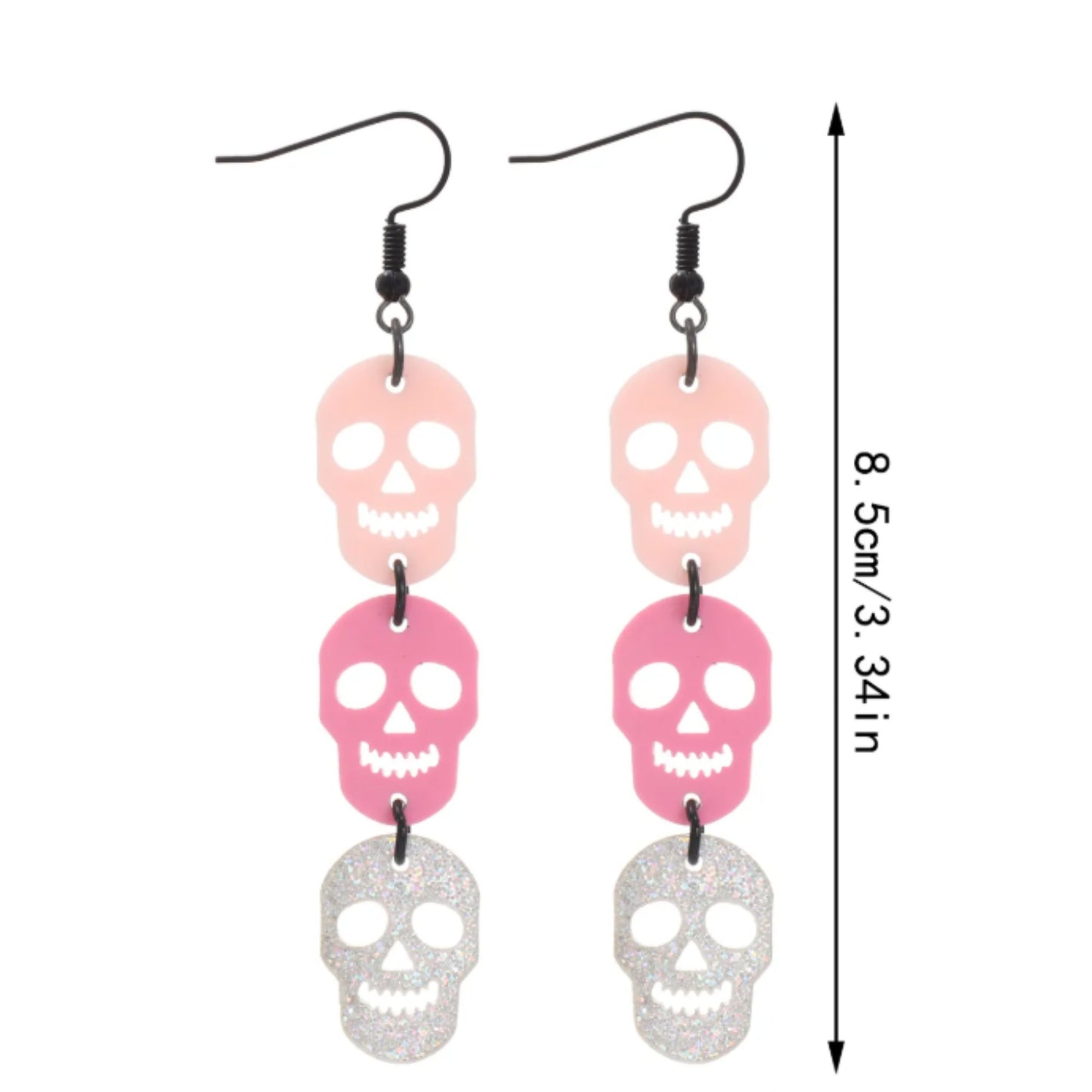 Skull-shaped earrings with pink and silver colors on a white background