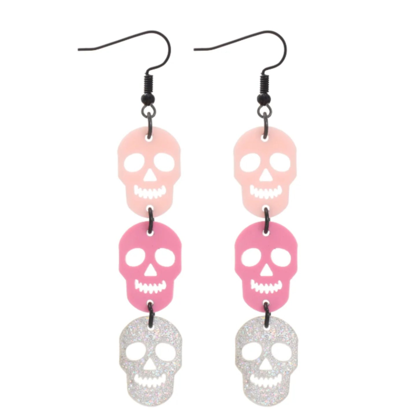 Skull-shaped earrings with pink and silver colors on a white background