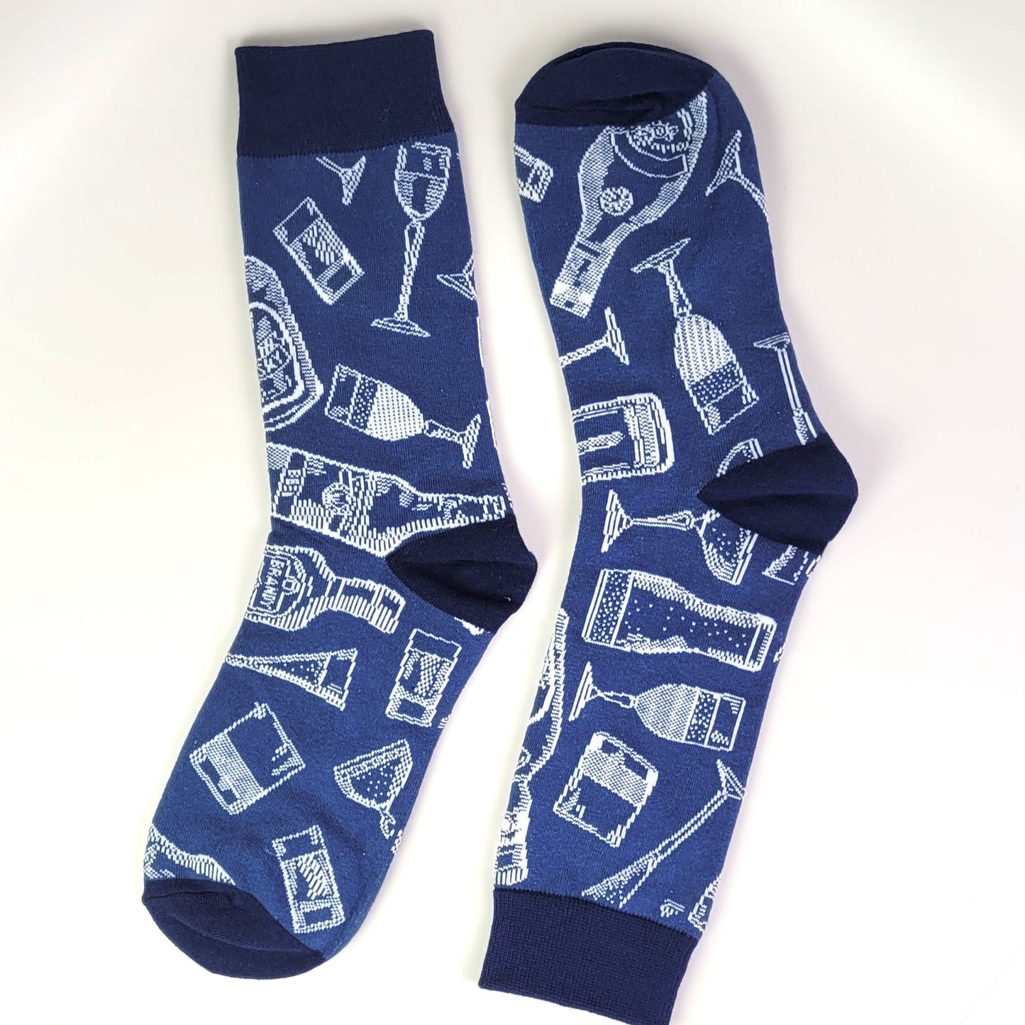 Blue socks with white drink-themed pattern on a white background