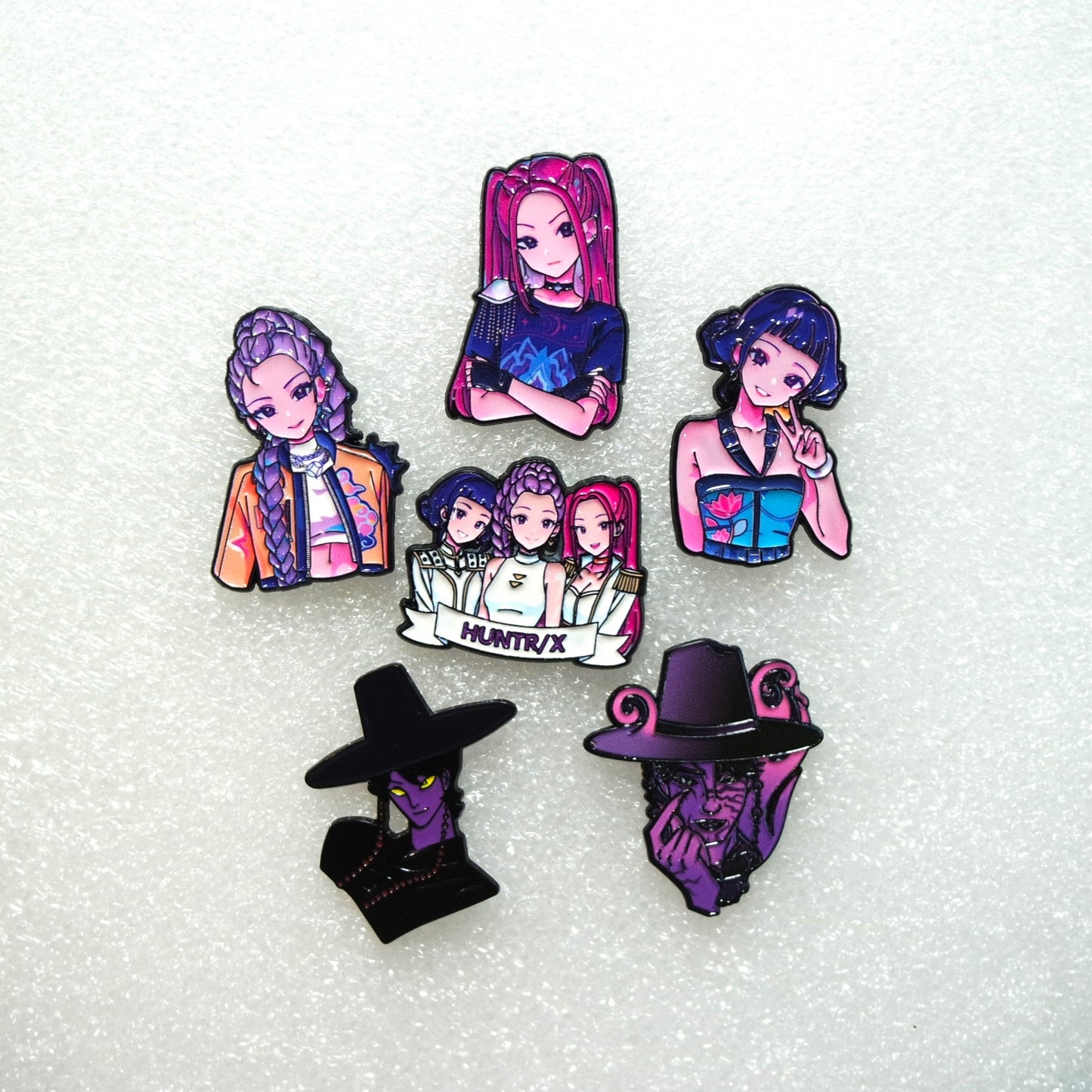 KPop Demon Hunters Movie character pins on a white background
