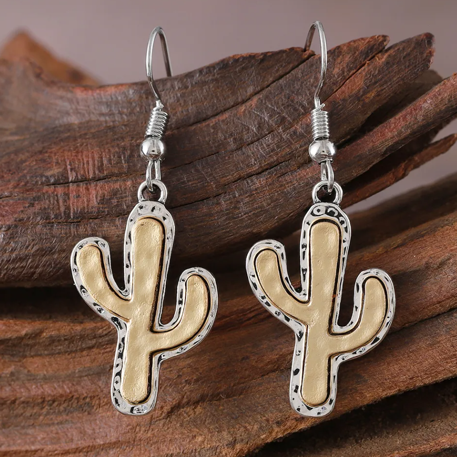Cactus-shaped earrings on a white background