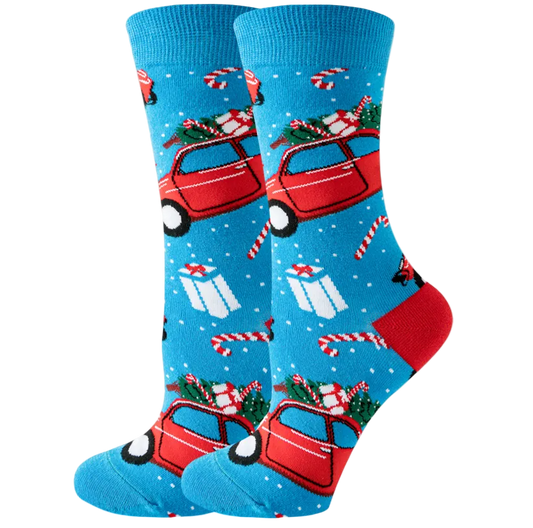 Christmas-themed socks with red cars, presents, and candy canes on a blue background.