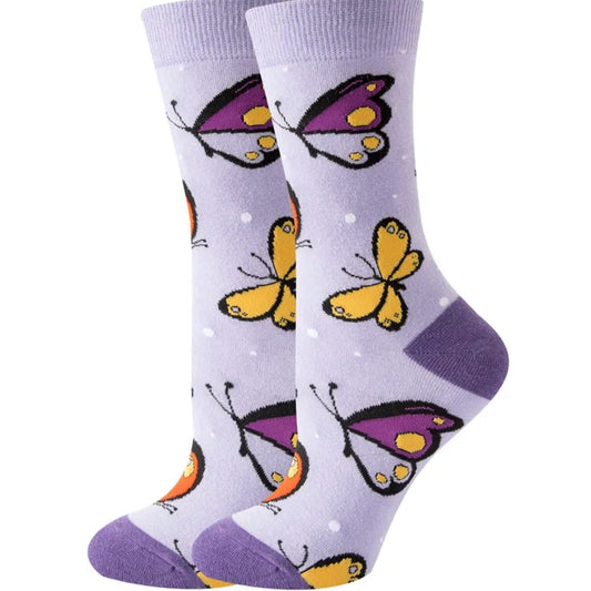 Purple socks with butterfly designs on a white background