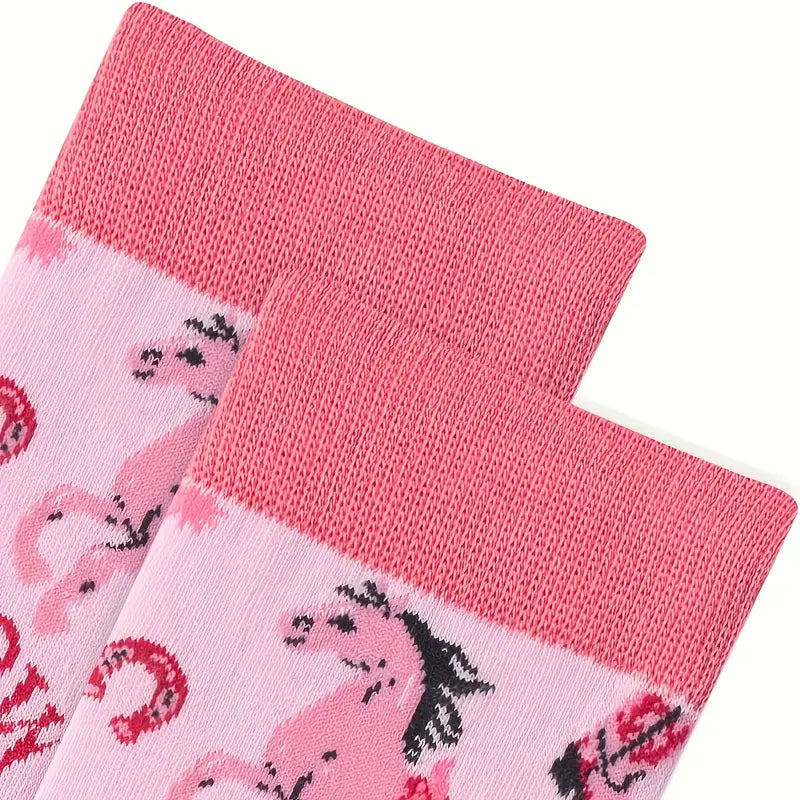 Two pairs of pink socks with cowgirl designs on a white background
