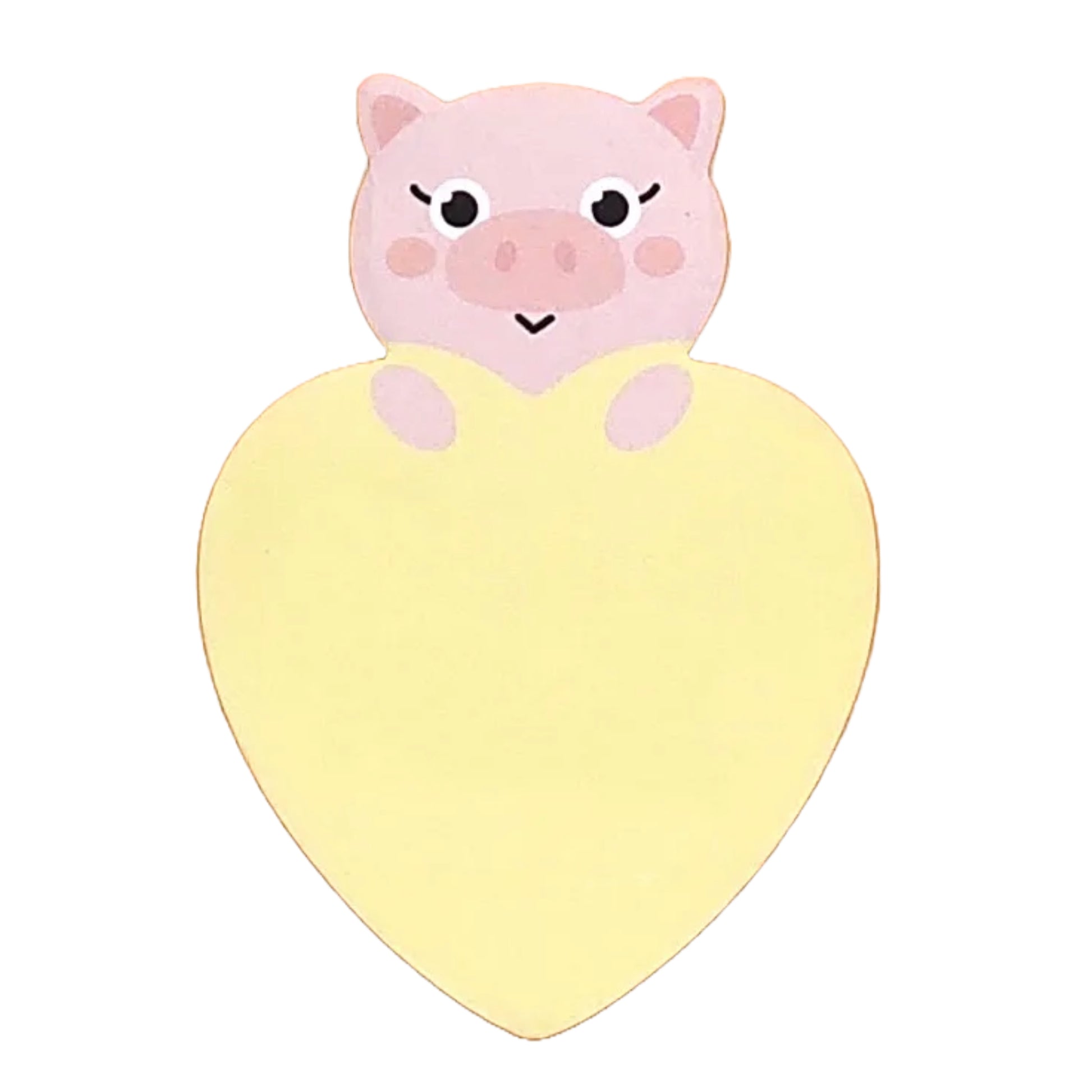 A heart-shaped pink sticky notepad with a cartoon pig design on the top edge.