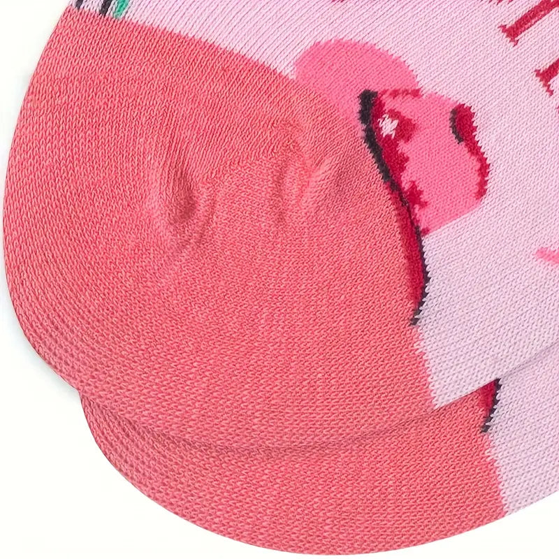 Close-up of pink socks with a cartoon character design on a white background
