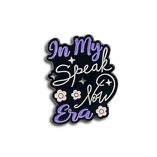 Black enamel pin with 'In My Speak Now Era' text and floral designs on a white background