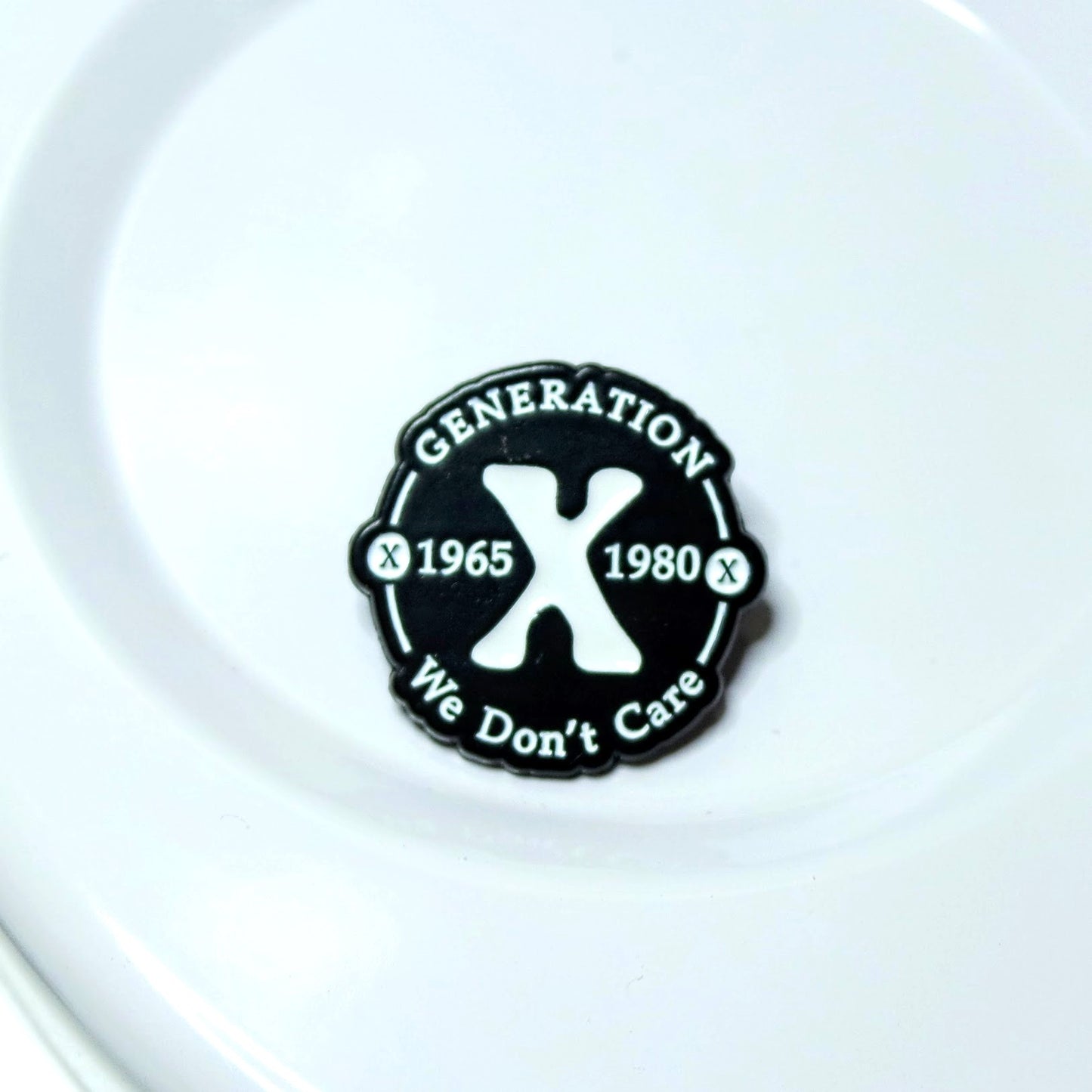 Black and white 'Generation X' badge on a white background