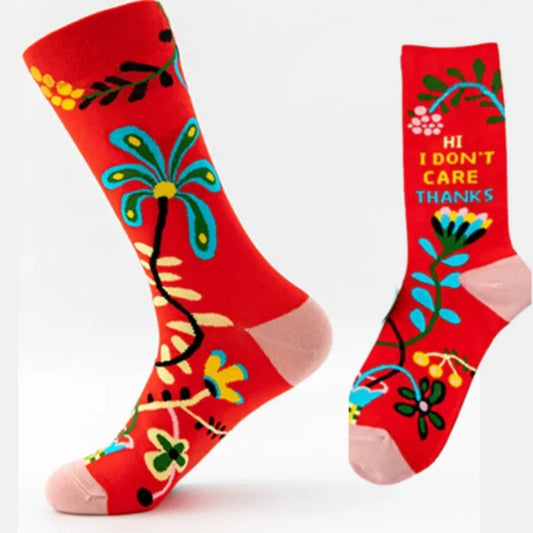 Red socks with colorful designs and text on a white background