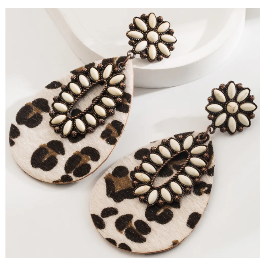 Leopard print earrings with white centers on a white background