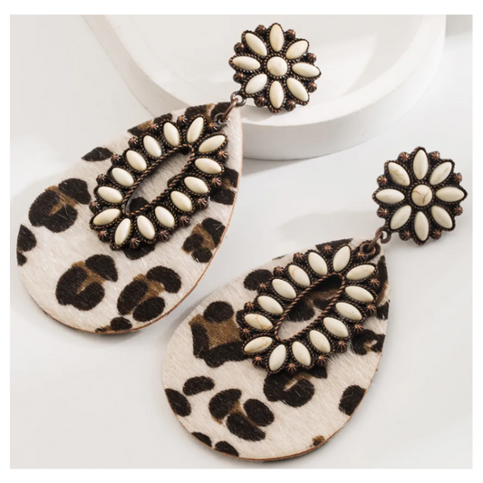 Leopard print earrings with white centers on a white background