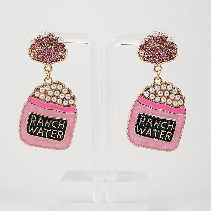 Pink 'Ranch Water' earrings with pearl details on a clear background