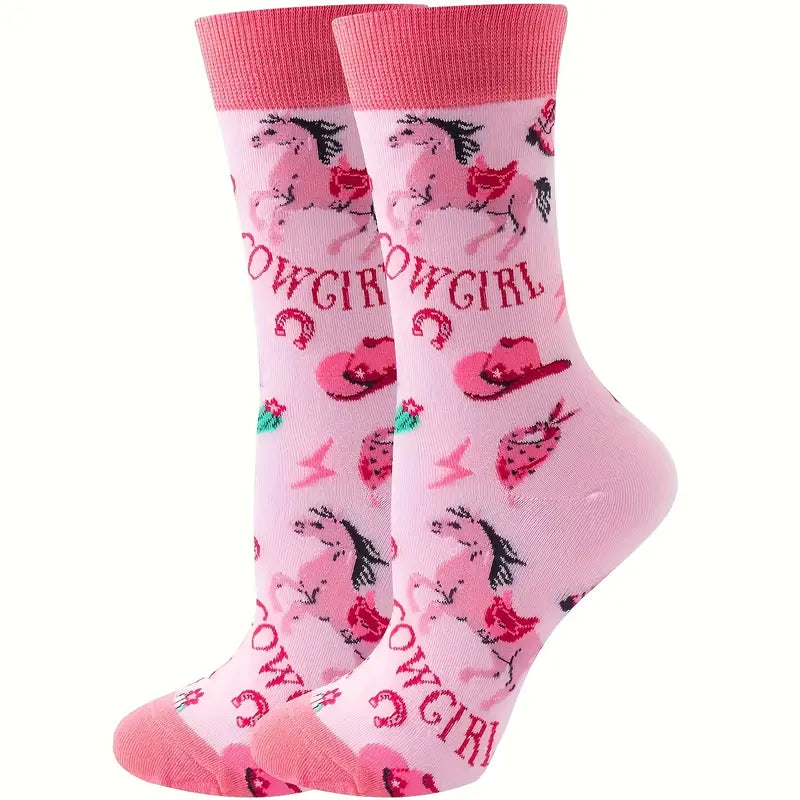 Pink cowgirl-themed socks with horseshoes and cowboy hats on a white background
