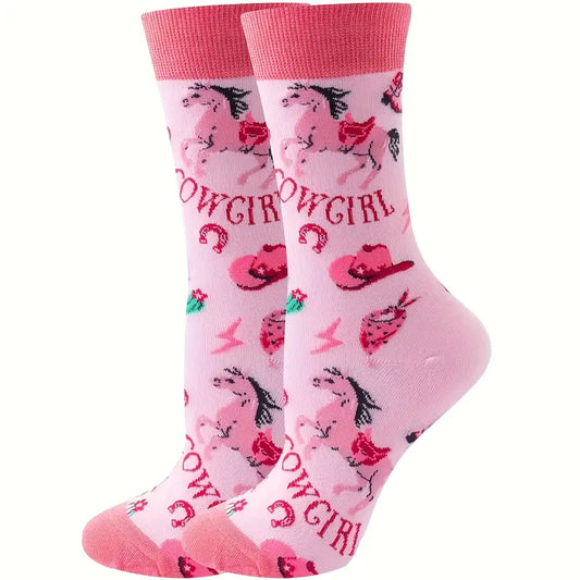 Pink cowgirl-themed socks with horseshoes and cowboy hats on a white background