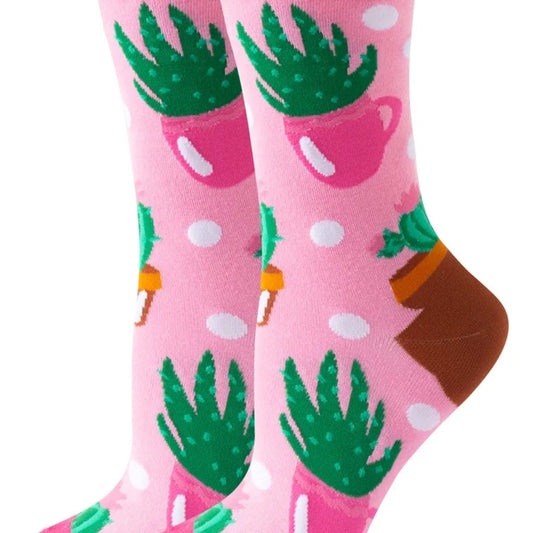 Pink socks with green cactus designs on a white background