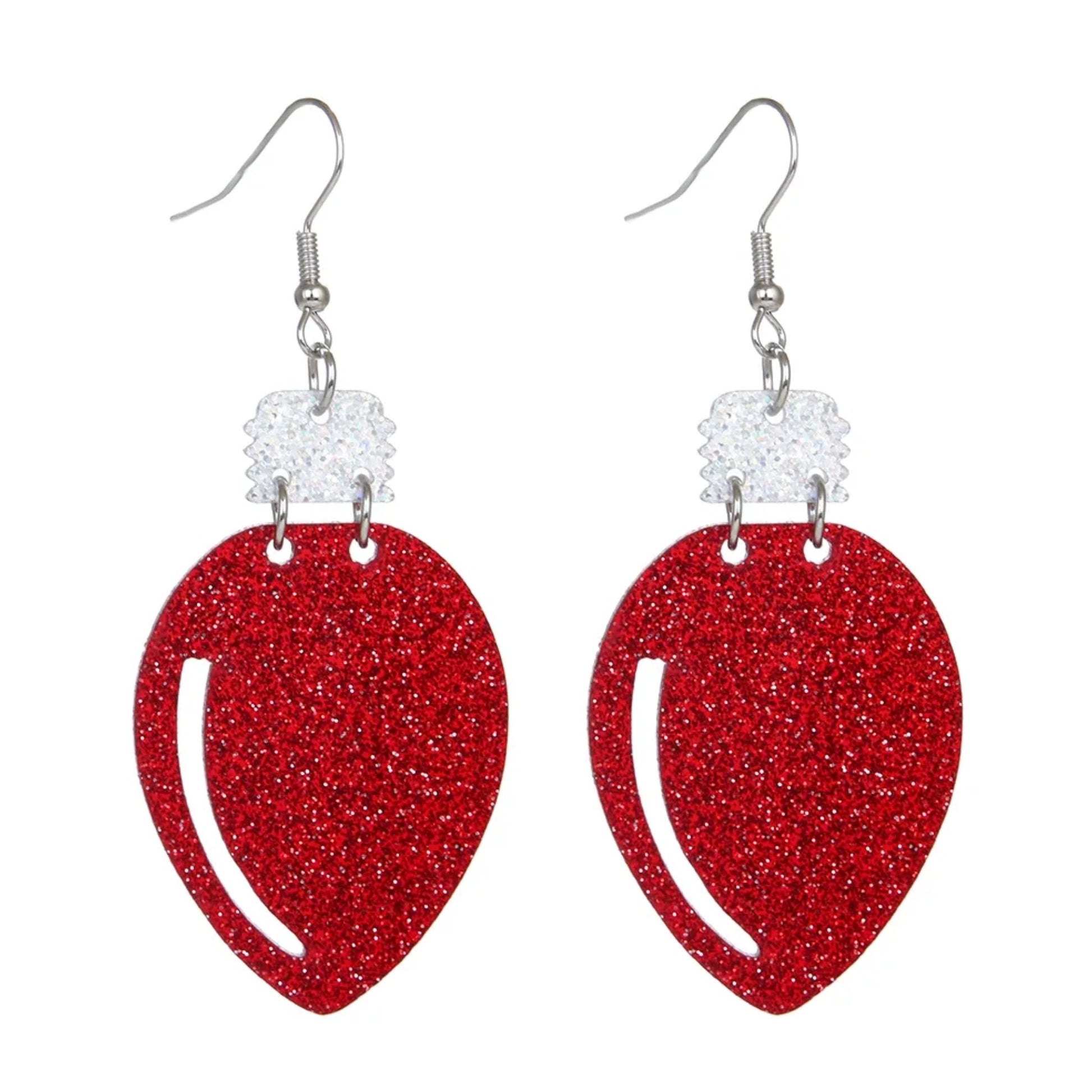 Red glittery heart-shaped earrings on a white background