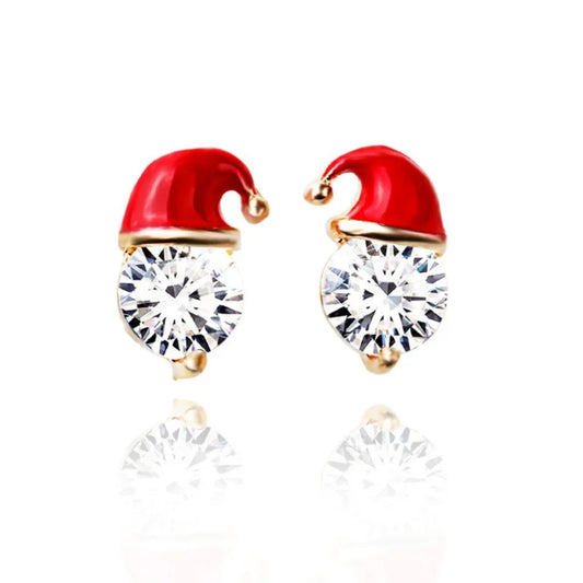 Earrings with red Santa hats and clear gemstones on a white background