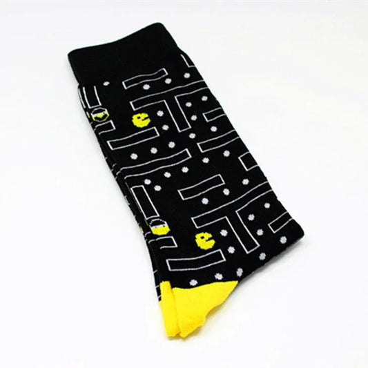 Black sock with white maze pattern and yellow Pac-Man characters on a white background