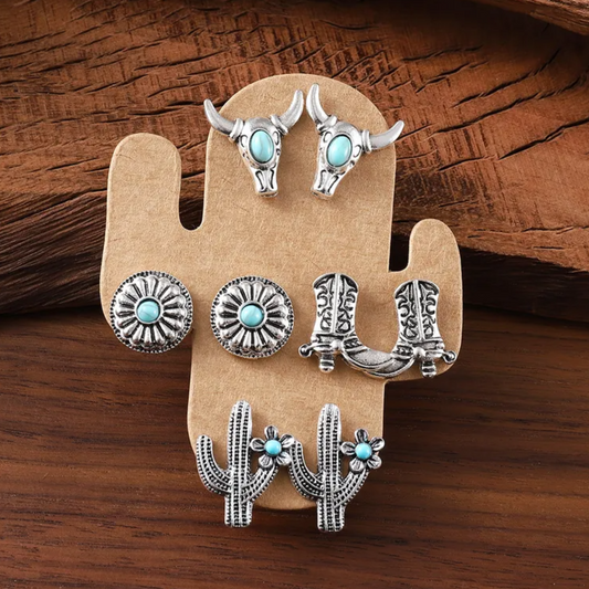 Set of silver and turquoise jewelry on a wooden display