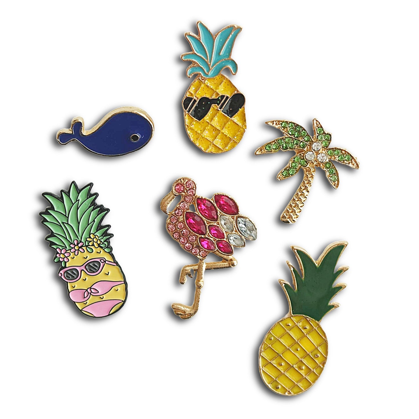 Set of colorful pins including pineapples, a flamingo, and a palm tree on a white background