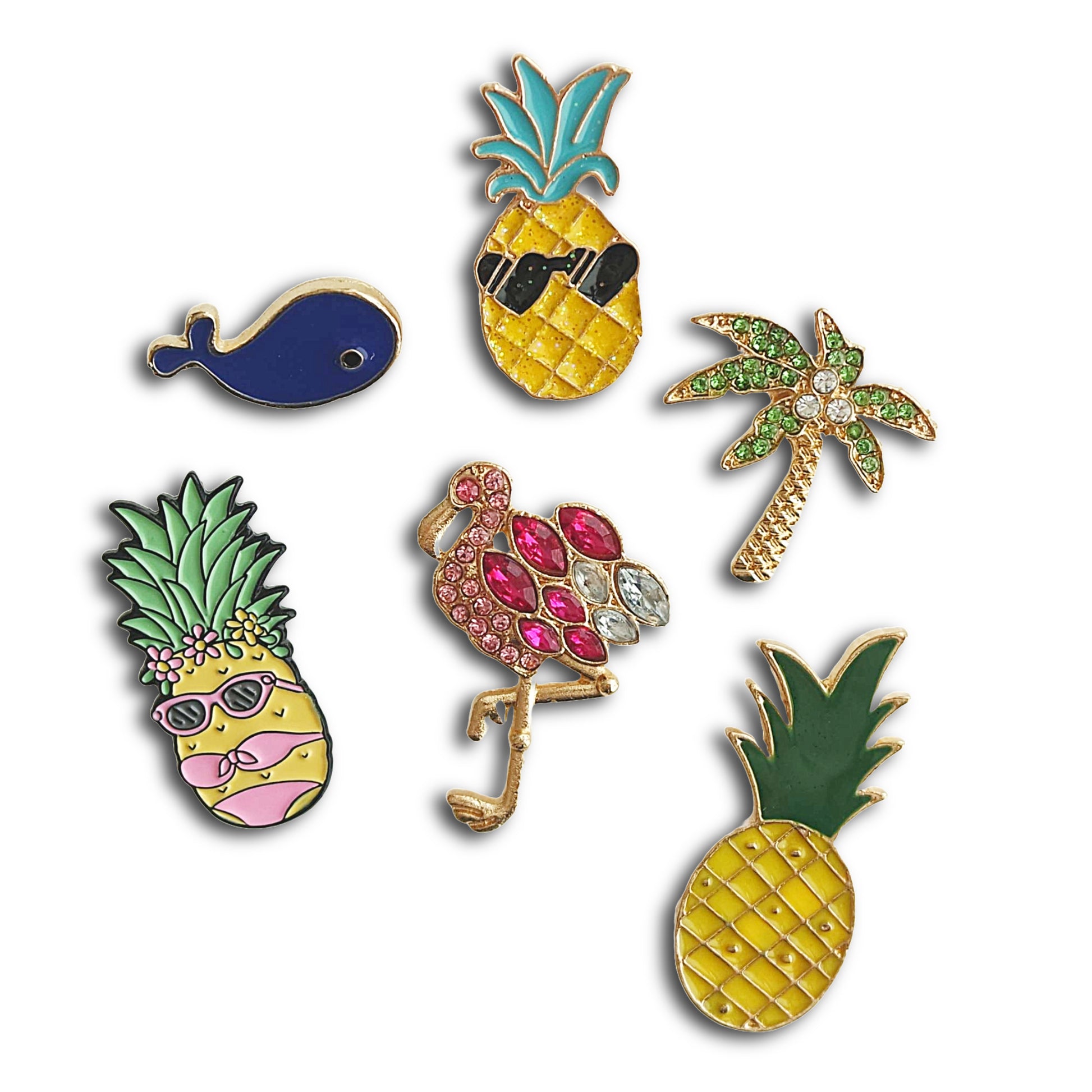Set of colorful pins including pineapples, a flamingo, and a palm tree on a white background