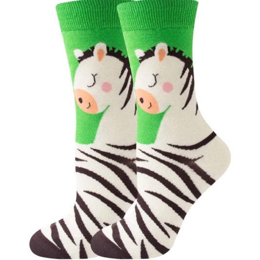 Zebra-themed socks with green cuffs on a white background