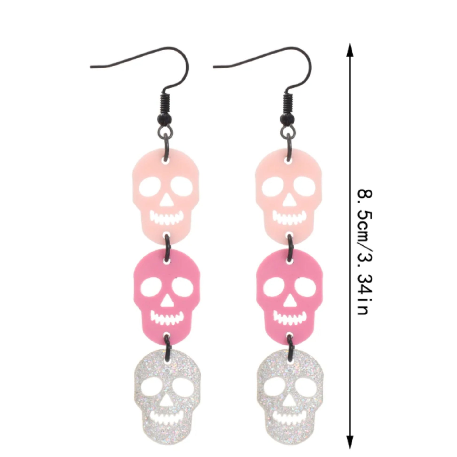 Skull-shaped earrings with pink and silver colors on a white background
