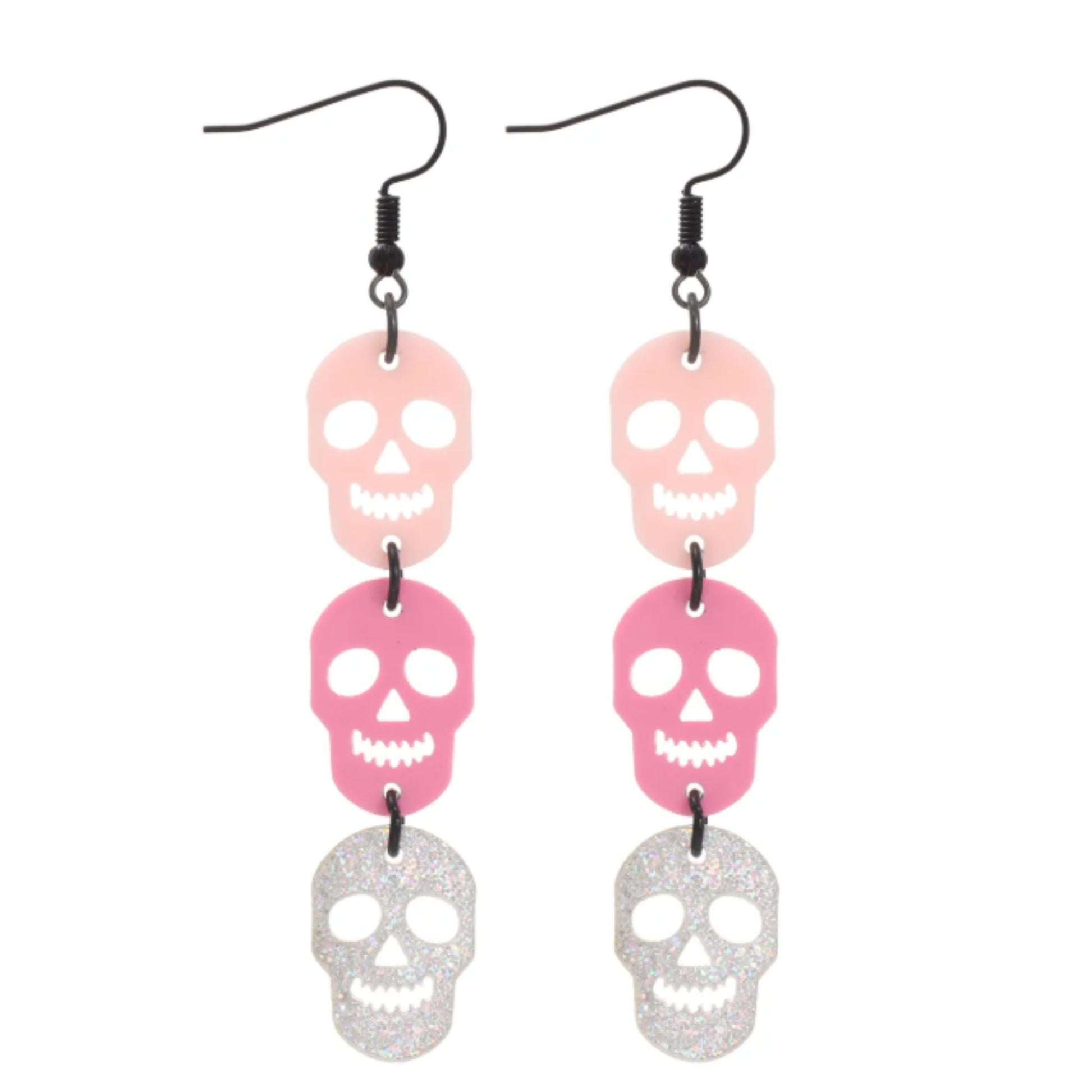 Skull-shaped earrings with pink and silver colors on a white background