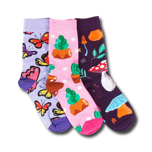 Three pairs of colorful socks with butterfly, cactus, and mushroom patterns on a white background.