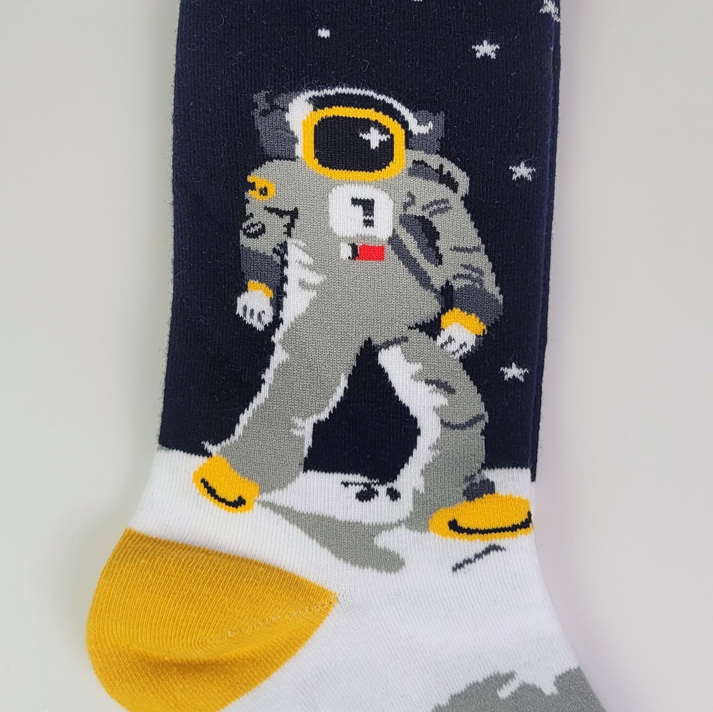 Sock with an astronaut design on a navy background